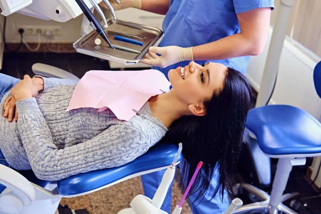 Young Woman Undergoing Wisdom Teeth Extraction